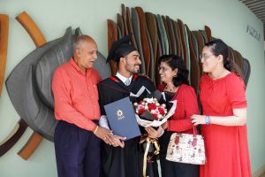 ACCA graduates with his family